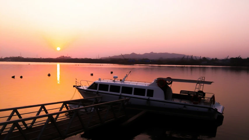 a boat is docked in the middle of a body of water