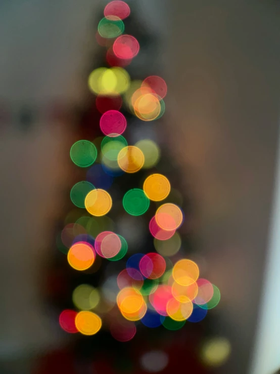 a blurry christmas tree in the middle of the night