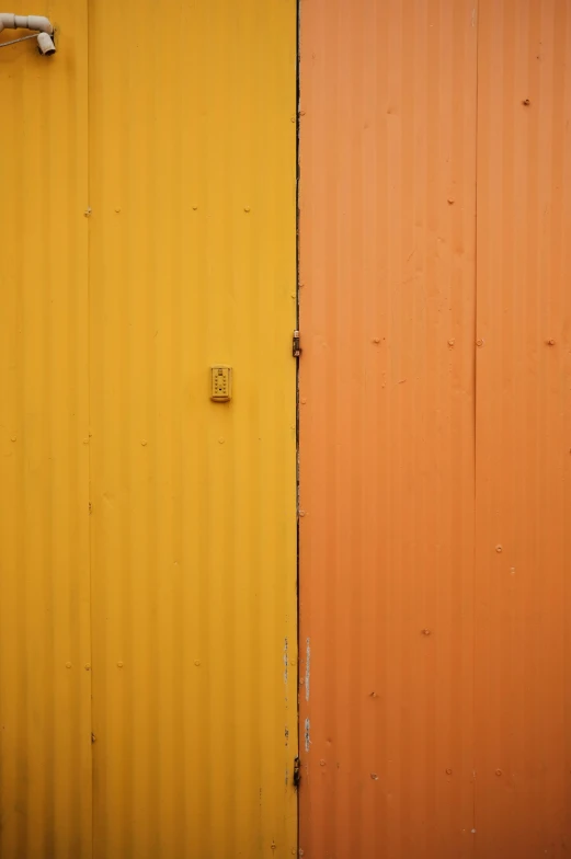 two bright yellow and one orange wall in different colors