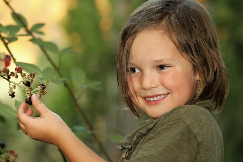 a  holding berries in her hand