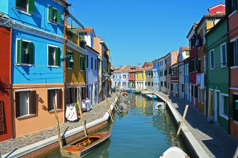 a canal with many different colored buildings along it