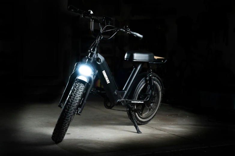 a bicycle parked on the street at night