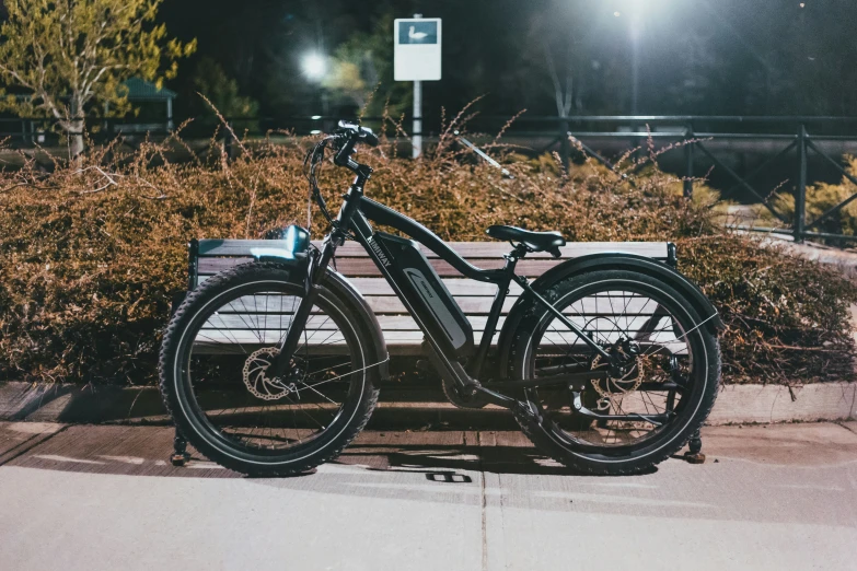 a bicycle is parked at the edge of the walkway