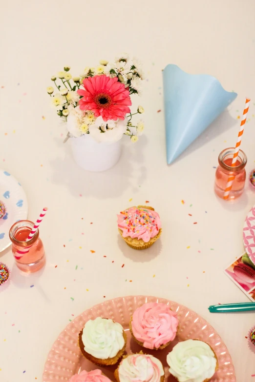 a plate with cupcakes on top of it