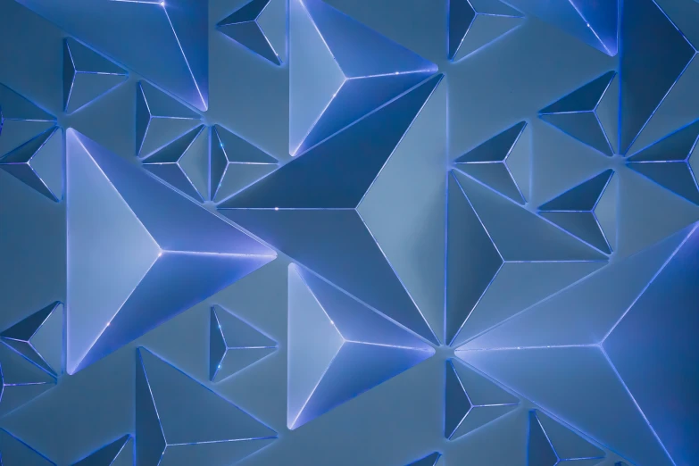 a large wall covered in blue shapes