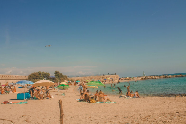 people enjoy the beach and it is sunny