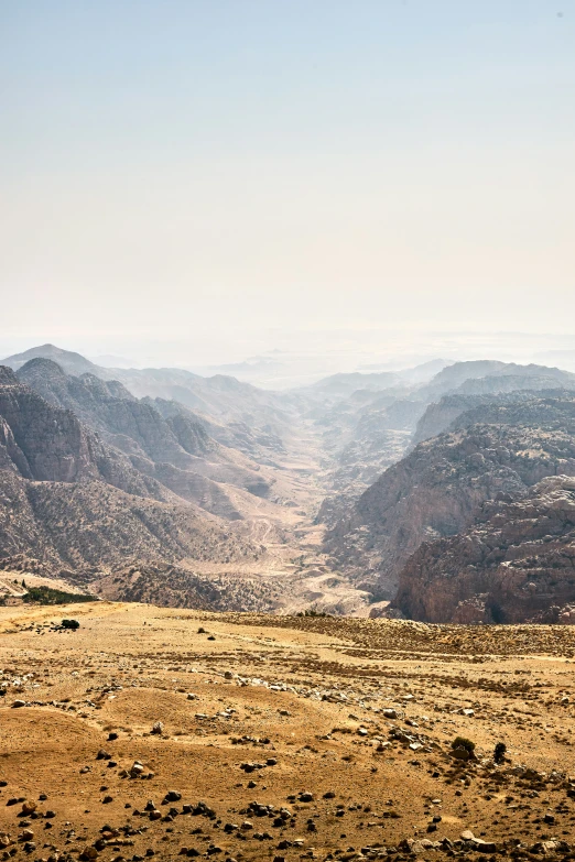 an image of mountains that are in the middle of desert