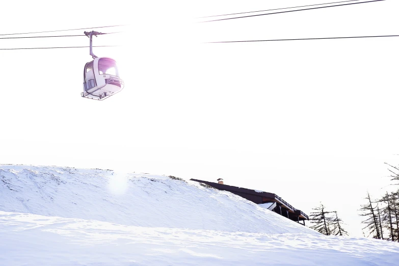 the snowboarder has come down the hill under the ski lift