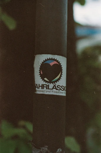close up view of an earth class sticker on a pole