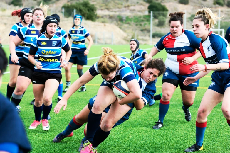 a woman is going to hit the ball while others look on