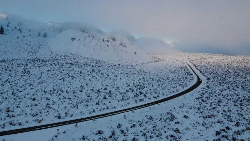 snowy hills with tracks on a snowy day