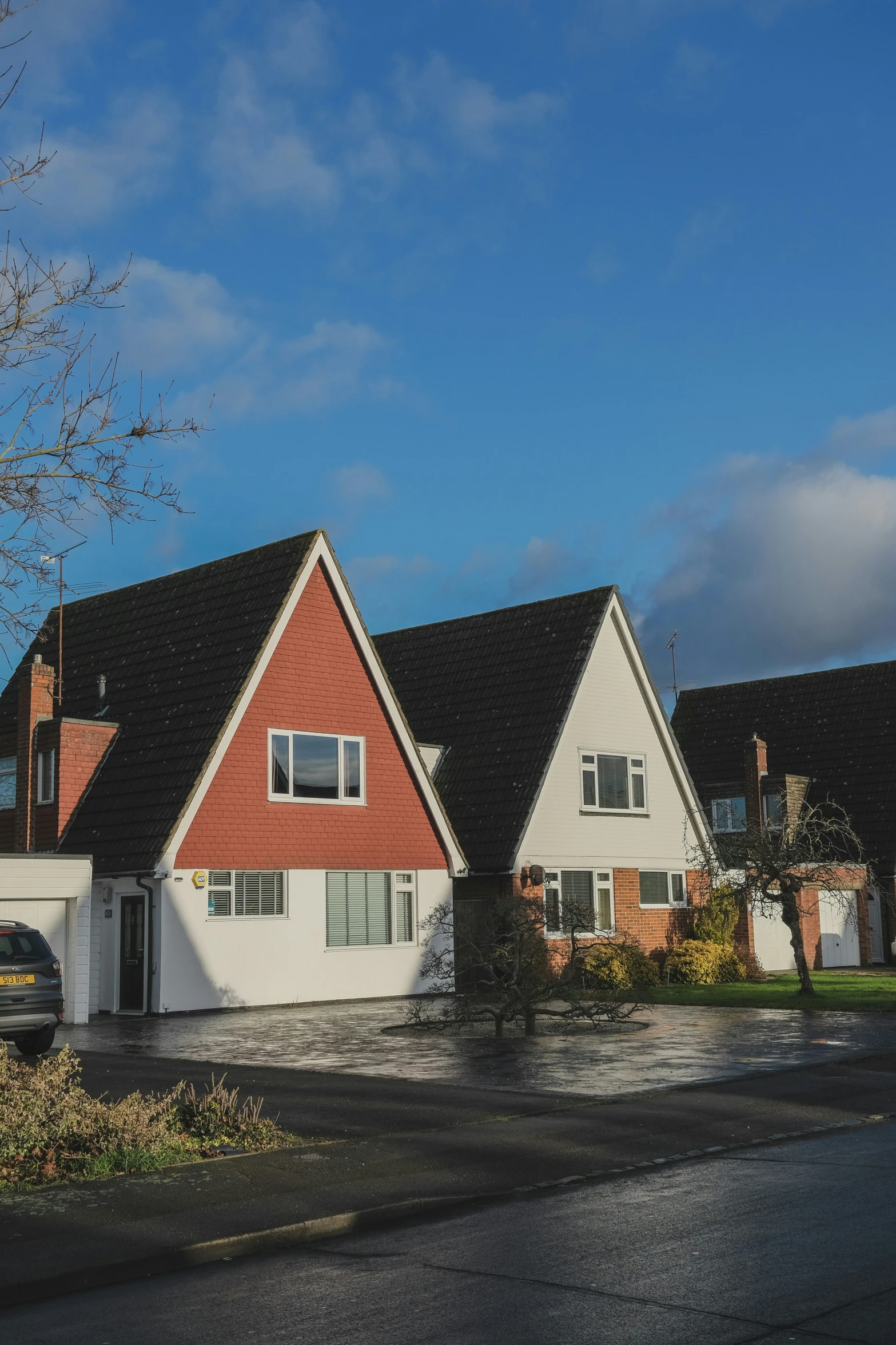 a row of houses sitting side by side in the snow