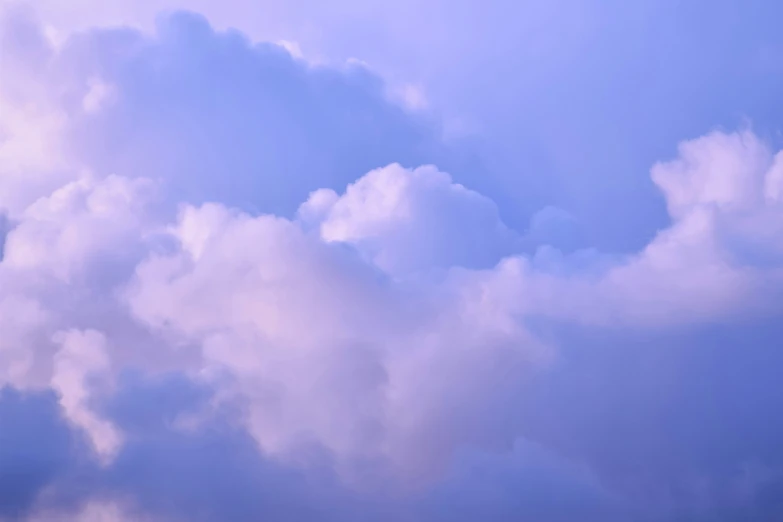 there is a blue cloudy sky with planes flying over it