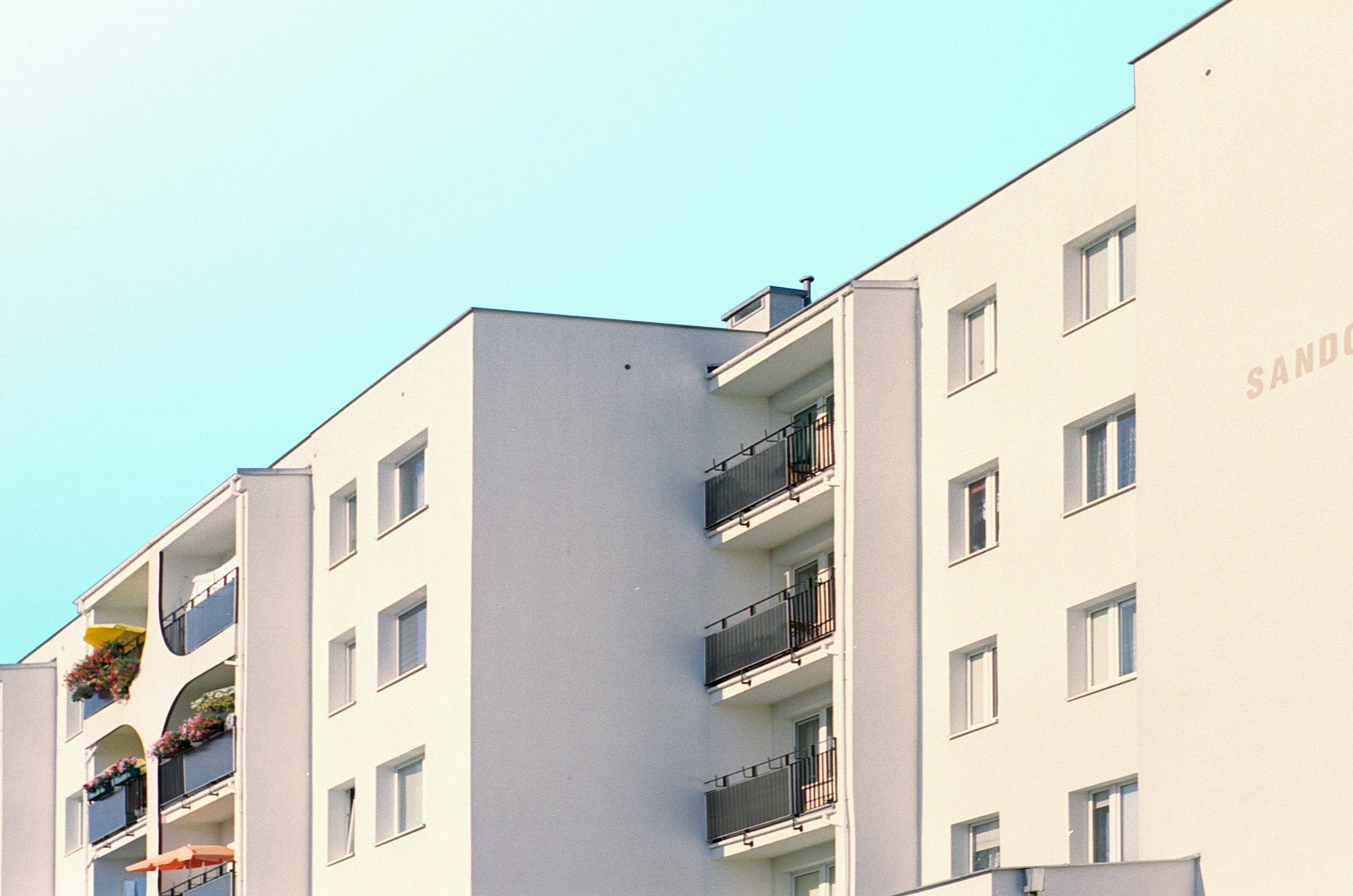 multiple apartment buildings with balconies and balconies on balconies