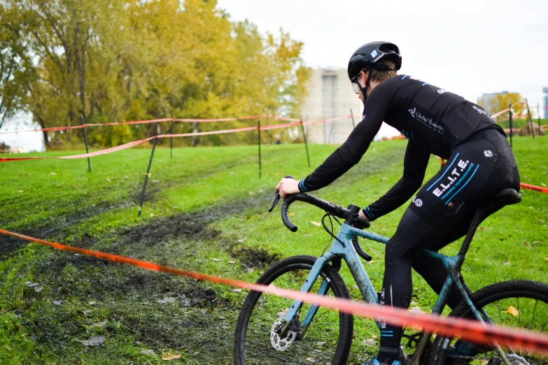 a bicyclist is riding through a track in the mud