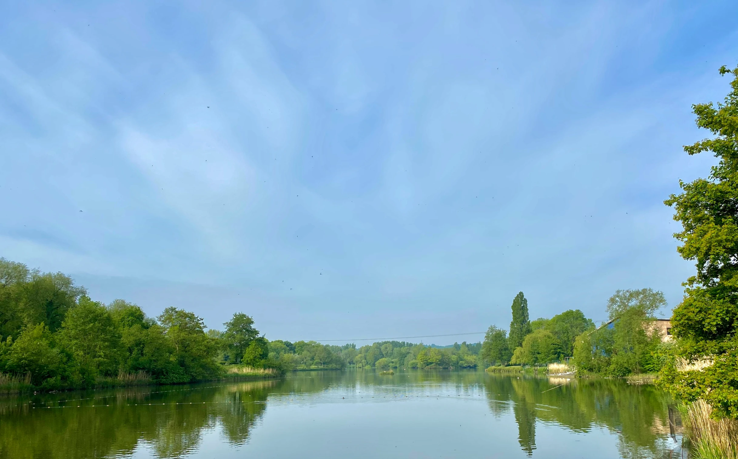 the river is clear with some very bright clouds