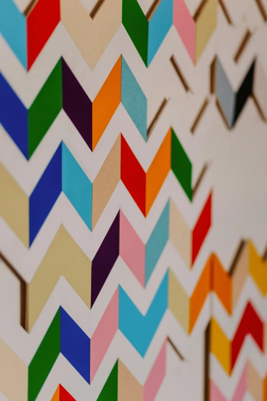 an art work that is made up of different colored paper strips