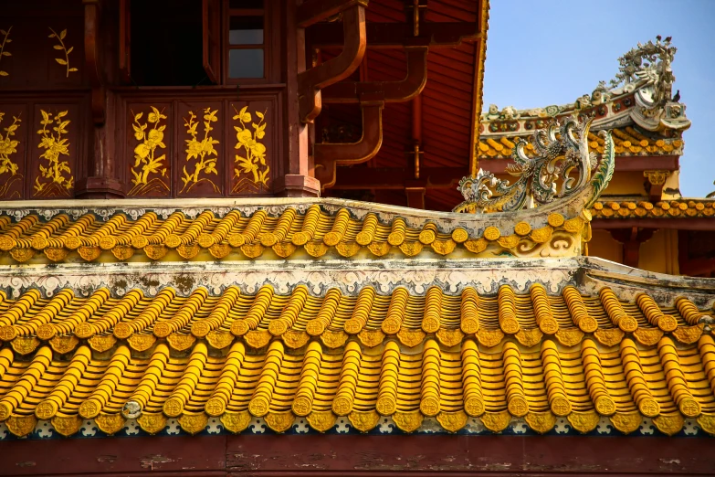 a very tall building with some roof tiles on it