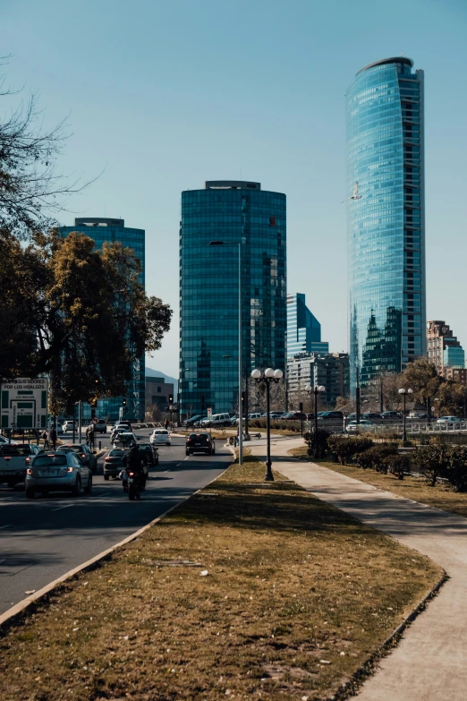 a large city has a street with tall buildings