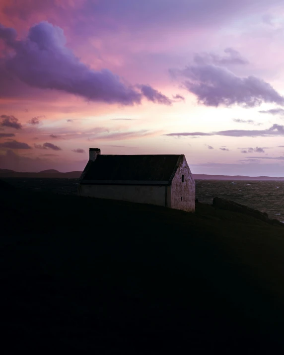 a white church sitting on top of a hill