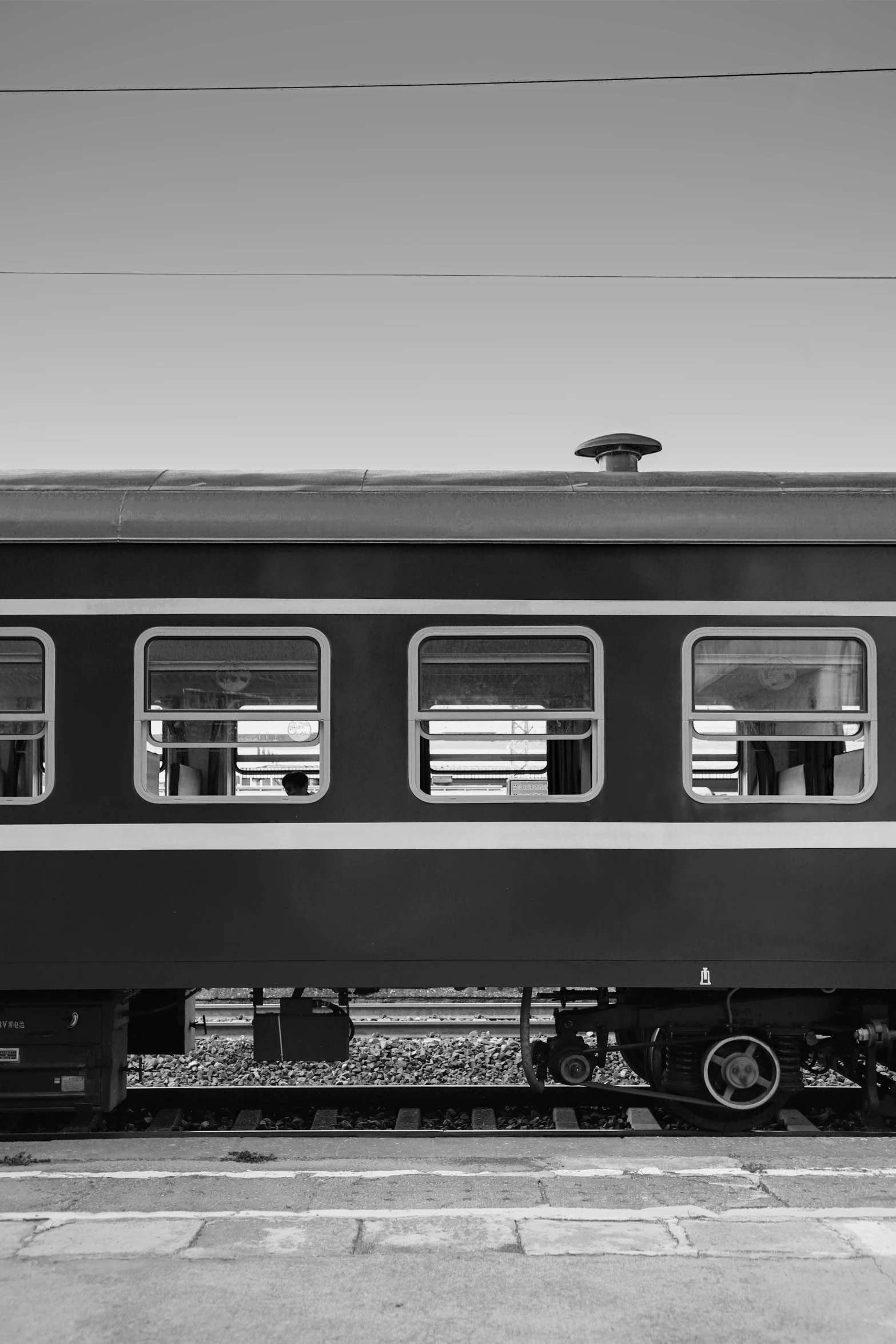 a train traveling down tracks next to a loading platform