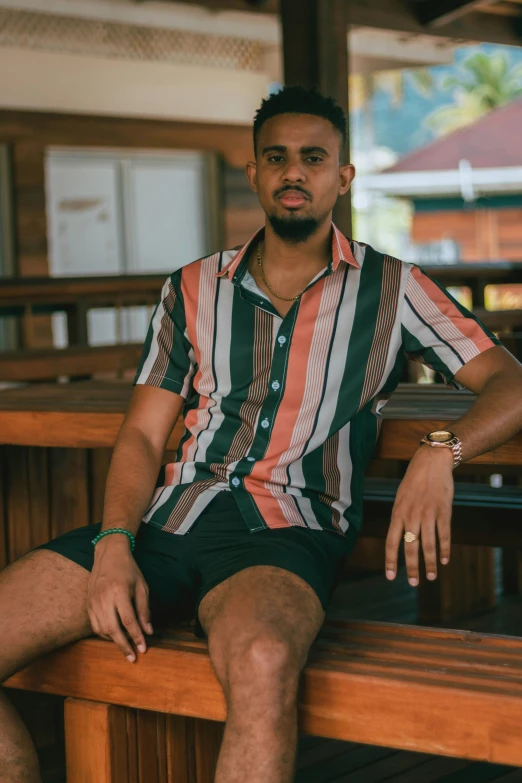 a man sitting on a bench looking into the camera