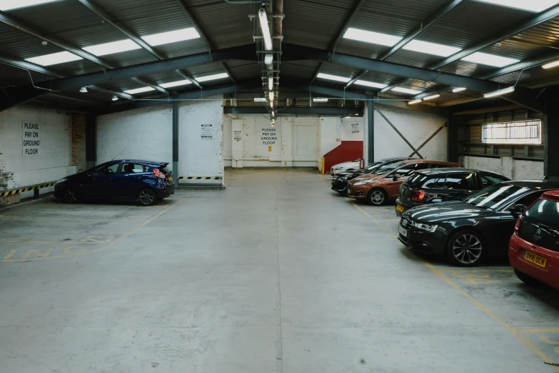 a car is parked in a garage with the door open