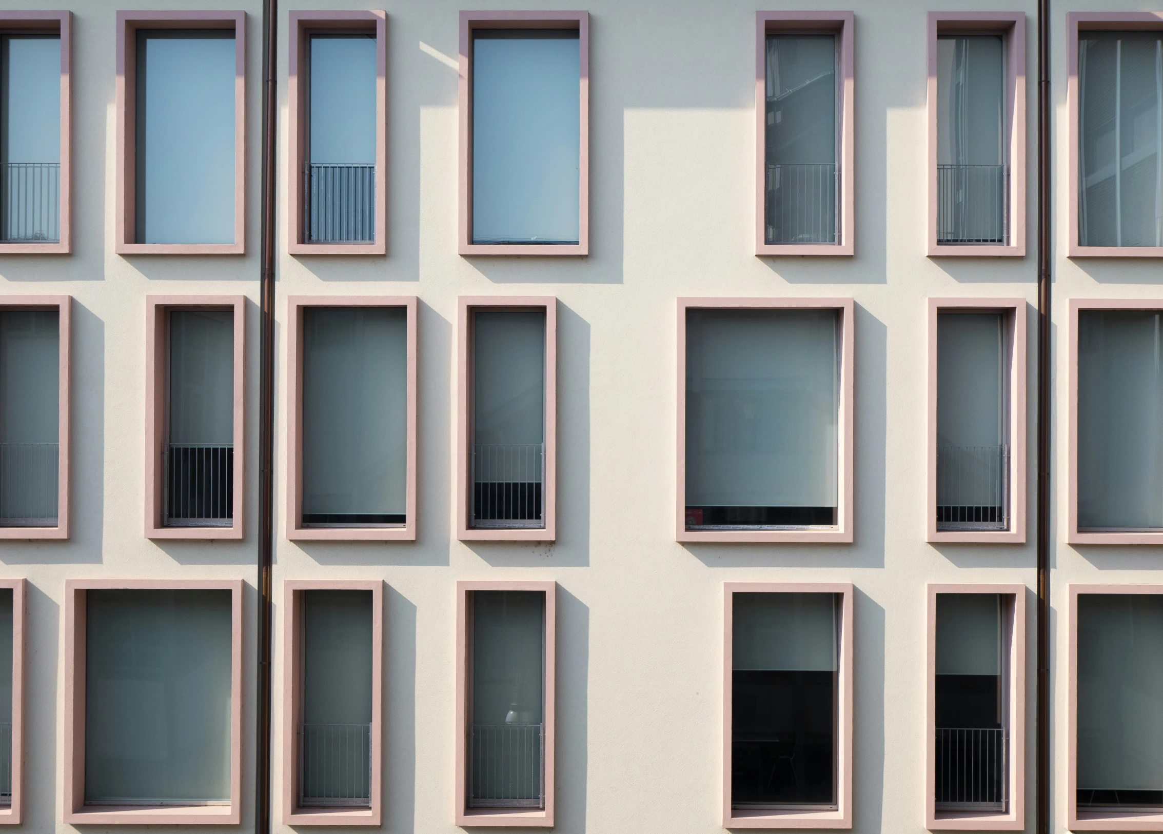 a large building with several windows made out of brick