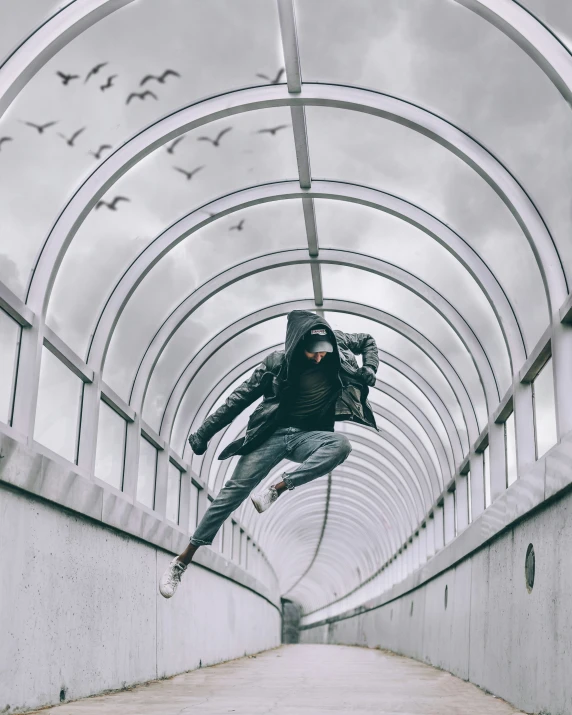 a person jumping on a bridge with a skate board