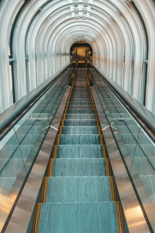 an escalator at the entrance to an underground terminal