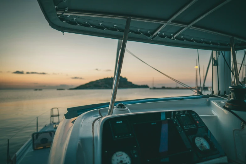 the view from inside of a boat as the sun rises