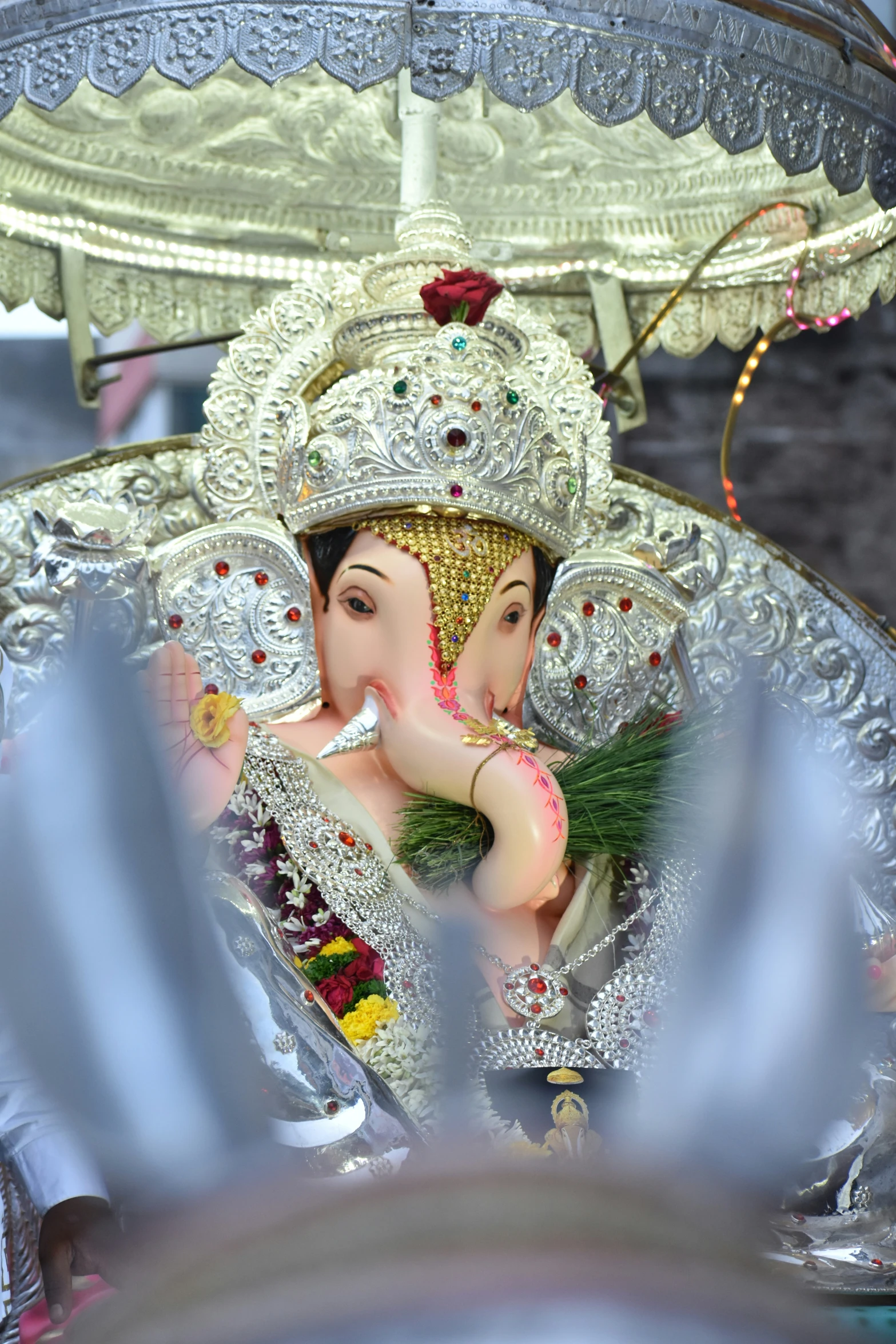 a statue of an elephant with its head in its hands