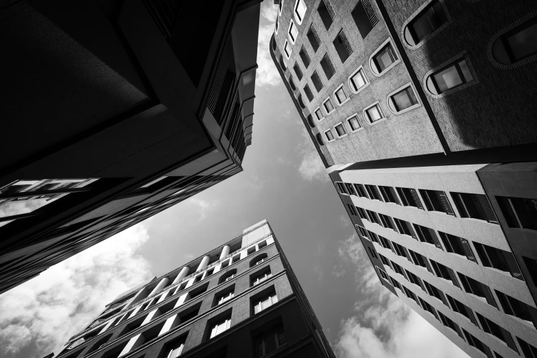 looking up at tall buildings in a city