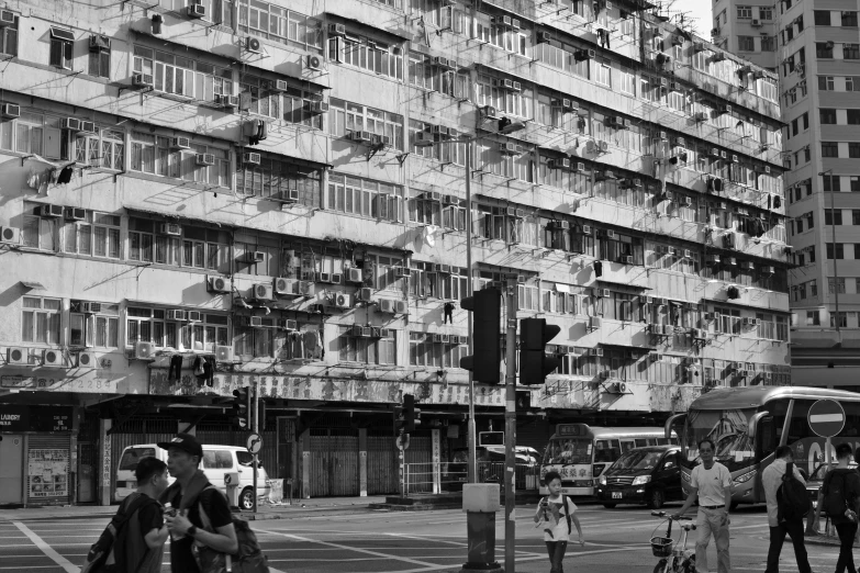 a city intersection has traffic signals and pedestrians