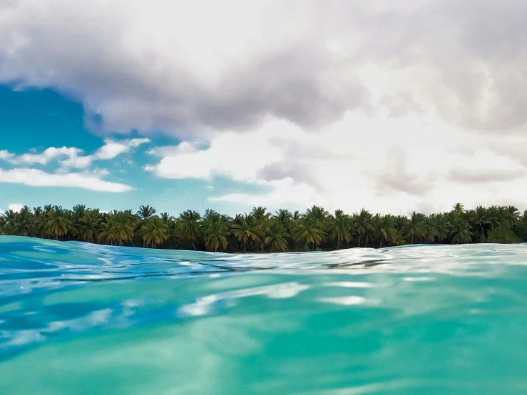 a small tropical island in the middle of water