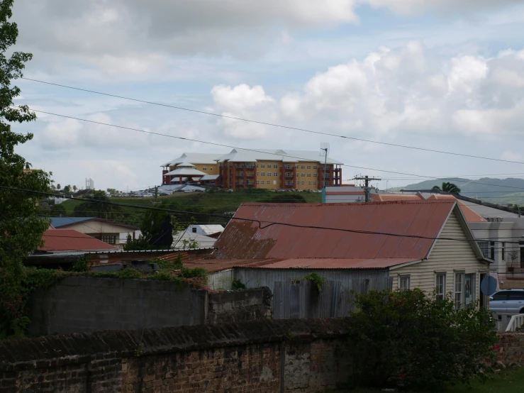 an urban area with houses and large hills behind them