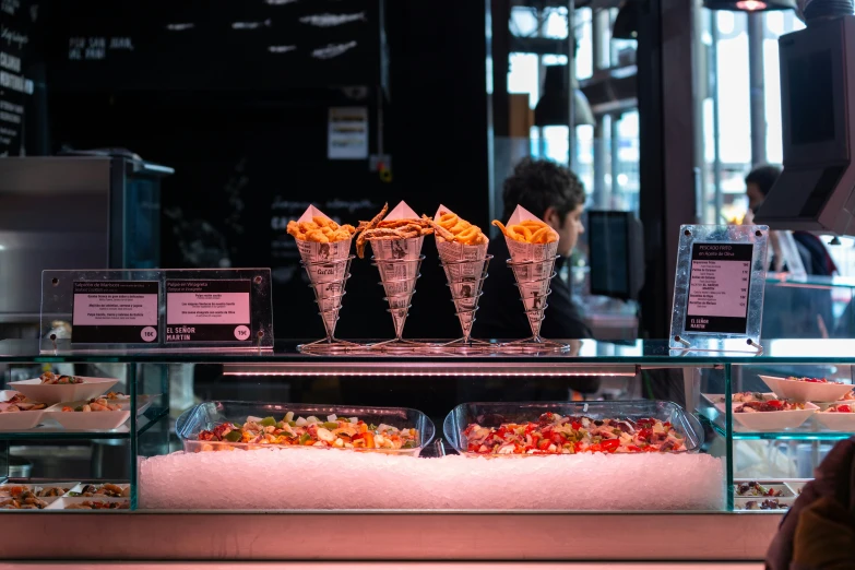 the assortment of food is on display at the front of the bakery