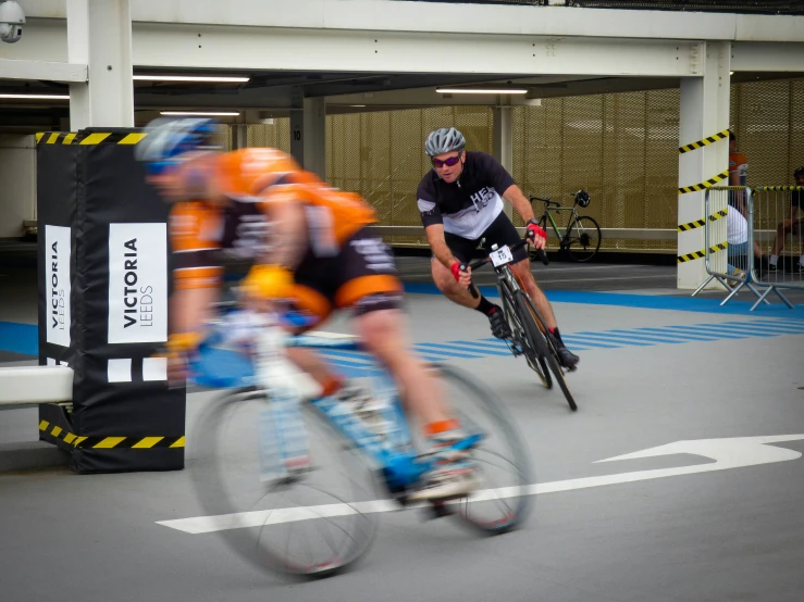 two bicyclists are competing in an amateur bike race