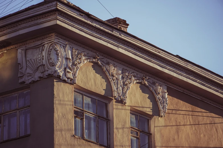 an ornate structure adorns a building on a sunny day