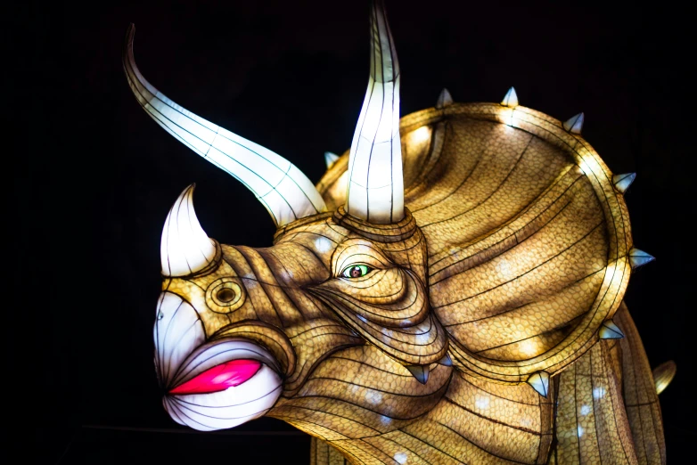 an elaborate wooden sculpture of a rhino head