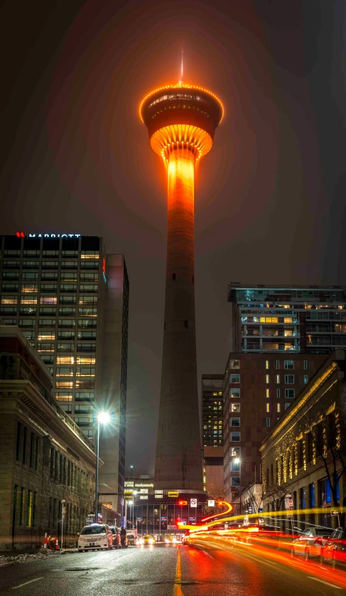 a building with light on its corner is lit up at night