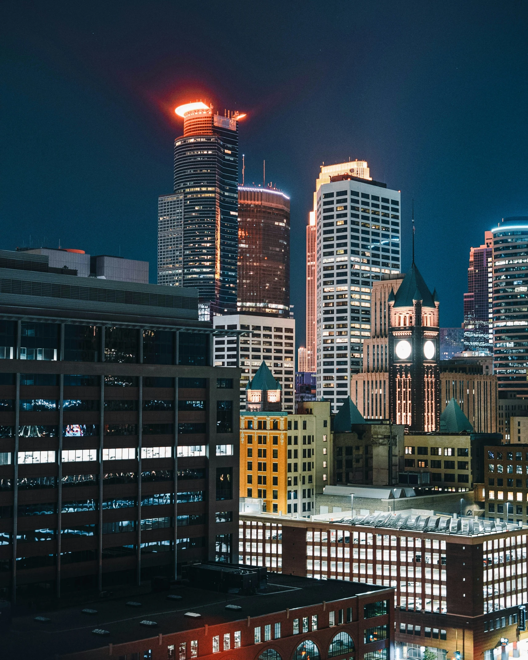 a group of city buildings on a dark night