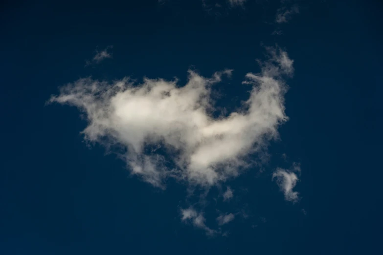 white cloud floating through the blue sky