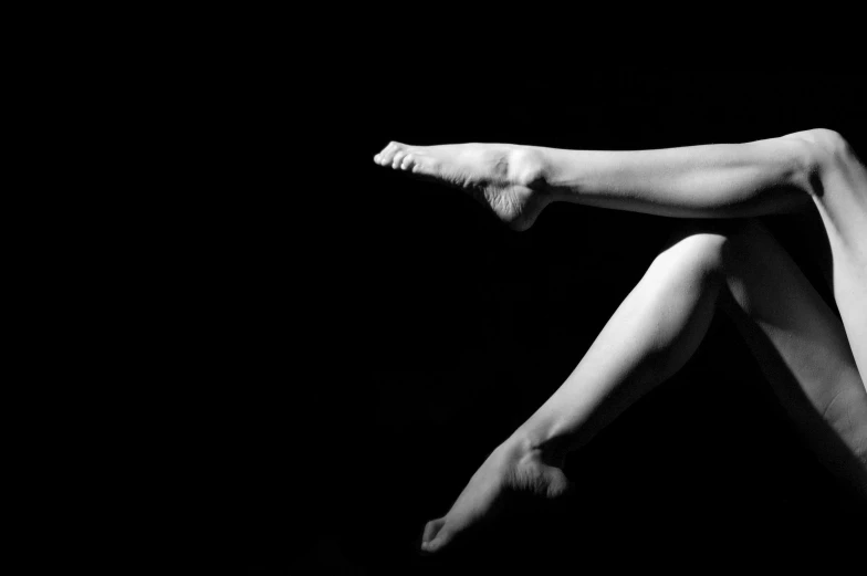 a woman floating in the air while holding onto a piece of paper