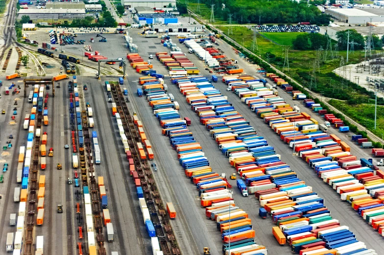 a train yard full of cars and trucks