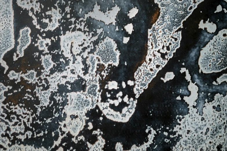 the top view of an abstract painting with black and white paint