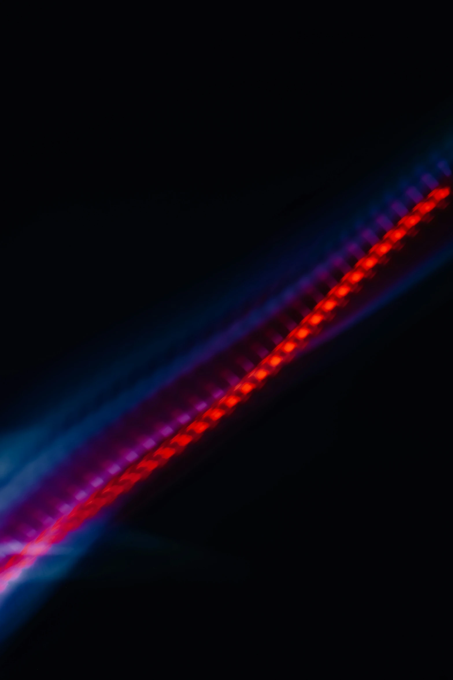 the image shows a long red, white and blue streak that appears to be distorted on a surface