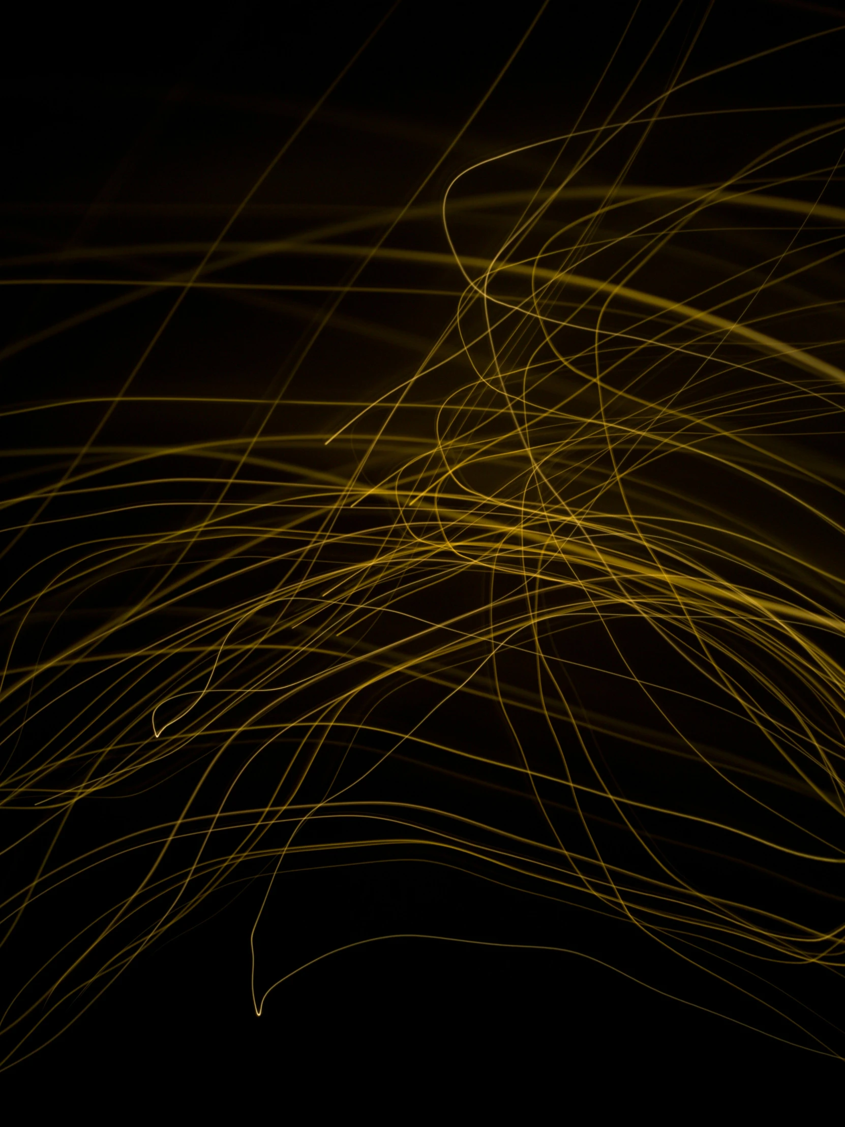 an abstract image of yellow lines in the dark