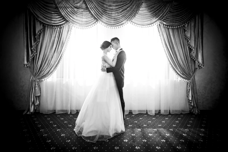 the bride and groom share a tender moment at their wedding