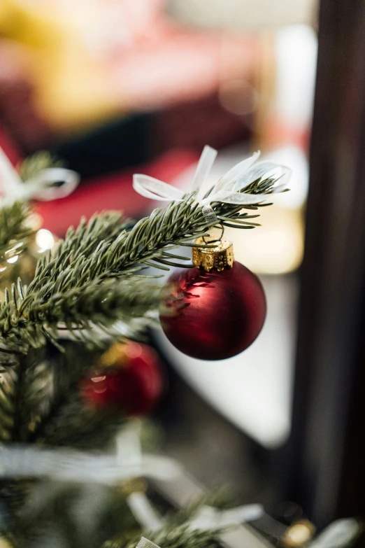 a small christmas ornament on a christmas tree